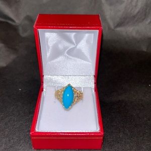 14k yellow gold with turquoise center stone